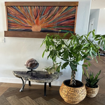 table piece next to two plants