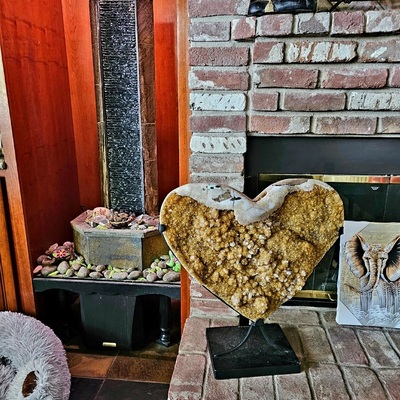citrine heart piece on brick fireplace